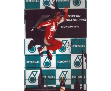 Fernando Alonso signed 12x8 inch colour photo pictured celebrating during his time with Ferrari in Formula One. Good conditio