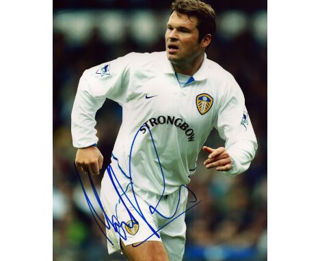 Mark Viduka signed 10x8 inch colour photo pictured in action for Leeds United. Good condition. All autographs come with a Cer