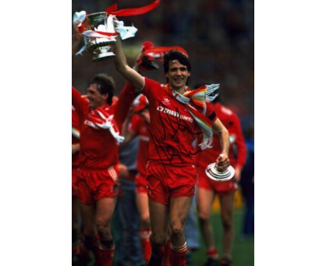 Alan Hansen signed 12x8 inch colour photo pictured with the FA cup during his time with Liverpool F.C. Good condition. All au