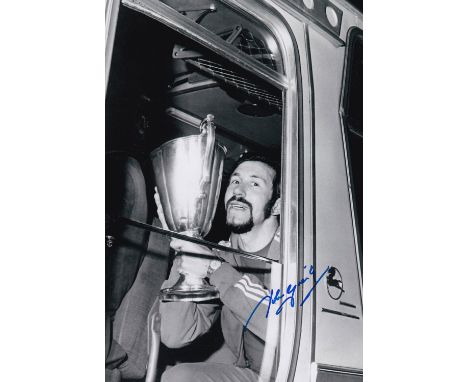 Autographed JOHN GREIG 12 x 8 photo : B/W, depicting Rangers captain JOHN GREIG posing with the European Cup Winners Cup, on 