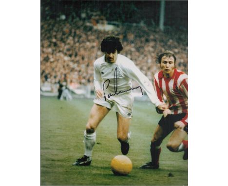 Peter Lorimer signed 10x8 inch colour photo pictured in action for Leeds United. Good condition. All autographs come with a C