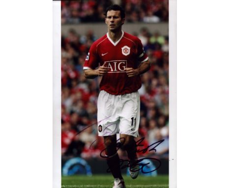 Ryan Giggs signed 12x8 inch colour photo pictured in action for Manchester United. Good condition. All autographs come with a