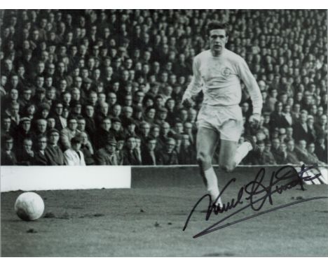 Norman Hunter signed 10x8 inch black and white photo pictured in action for Leeds United. Good condition. All autographs come