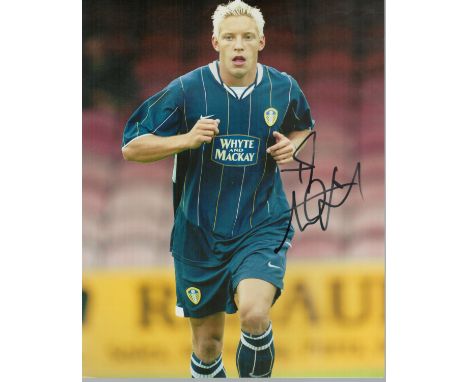 Alan Smith signed 10x8 inch colour photo pictured in action for Leeds United. Good condition. All autographs come with a Cert