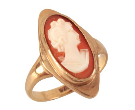 A VINTAGE CAMEO RINGin 9ct gold, set with a helmet shell, carved to depict the profile of a woman, to a stylised head, full B
