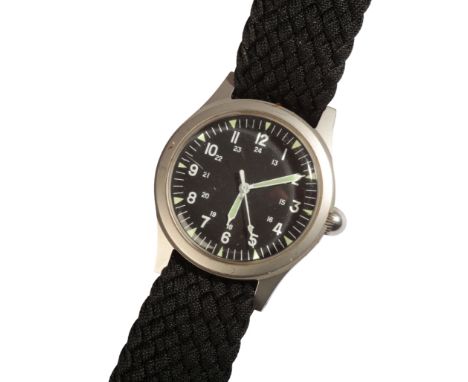 A GENTLEMAN'S USA MILITARY ISSUE WRISTWATCH with manual wind movement, the black dial with luminous Arabic numerals and white