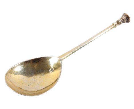 AN ELIZABETH I SILVER-GILT SEAL-TOP SPOONmaker's mark 'T' over a crescent, London 1598, with fig-shaped bowl, the tapering st