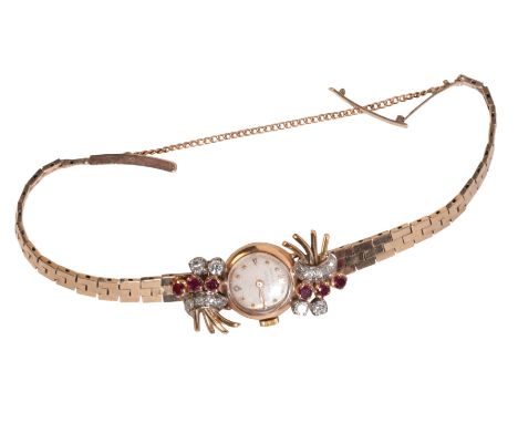 UNIVERSAL GENEVE: A LADY'S 9CT GOLD, DIAMOND AND RUBY-SET COCKTAIL WATCHwith manual wind movement, the silver dial with gold 