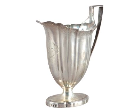 A GEORGE III SILVER CREAM JUGattributed to Robert Sharp, London 1813, of Neo Classical 'helmet' shape, with serpentine body a