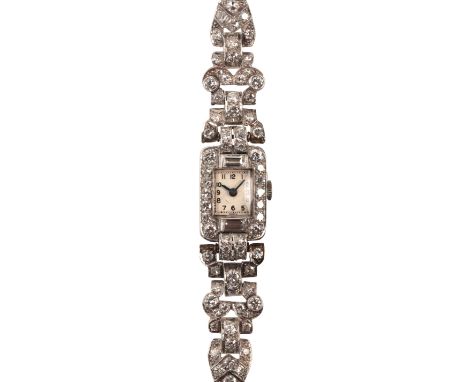 A LADY'S DIAMOND AND PLATINUM COCKTAIL WATCHwith manual wind movement, the case and bracelet encrusted with vari-cut diamonds