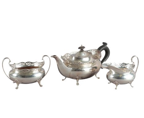 AN EDWARD VII SILVER THREE PIECE TEA SERVICEby Thomas Edward Atkins, Birmingham 1913, of squat oval form with plain bodies an
