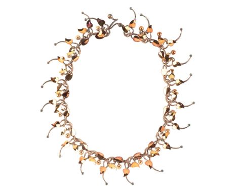 BRETT PAYNE: A 'FLOWER' NECKLACEin sterling silver and 18ct yellow and rose gold, comprising a series of fancy links with lea