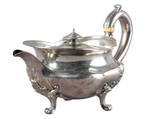 A WILLIAM IV SILVER TEAPOT by Robert Preston, London 1834, of squat form with three leaf capped legs, 'C'-shaped silver handl