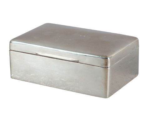 A GEORGE V SILVER CIGARETTE BOXby Adie Bros, Birmingham 1921, of plain form with domed lid and cedar wood lining, 5.5cm high 