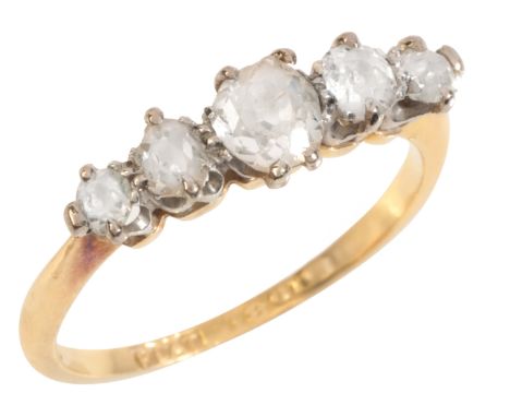 A DIAMOND FIVE STONE RINGin 18ct gold and platinum, set with five old mine cut diamonds, totalling c.0.75 carats, stamped 'PL