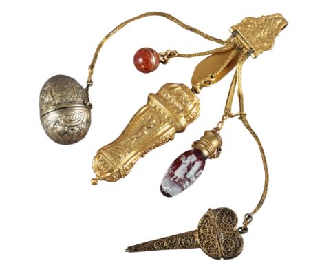 AN 18TH CENTURY GILDED WHITE METAL NUTMEG GRATERthe ovoid body embossed with flowers and scrolls, the inside lid bearing make