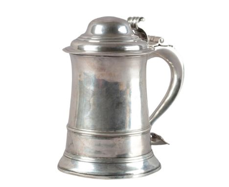 A GEORGE III SILVER LIDDED TANKARDby I. W (?), London 1761, with plain girdled body, hinged domed step lid, 'S'-shaped handle