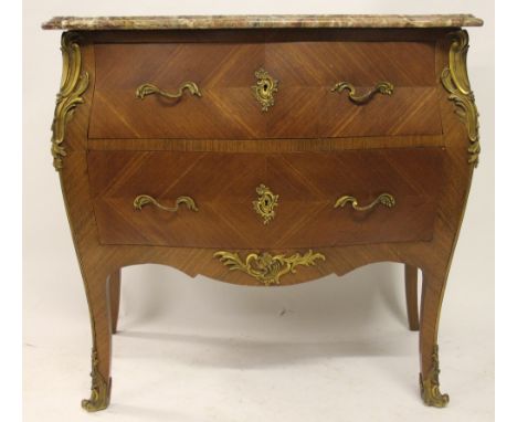 A French Louis XV style walnut bombe commode, with serpentine marble top, and two drawers, on cabriole legs, with gilt brass 