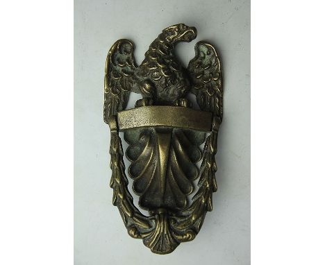 A brass door knocker in the form of an imperial eagle, 23cm