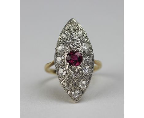A diamond and ruby marquise shaped cluster, the central ruby within a two tier diamond set surround, all set in white metal t