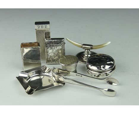 A selection of small silver to include; a Dunhill lighter, a silver ash tray, Sheffield 1939, a silver vesta sleeve, a silver