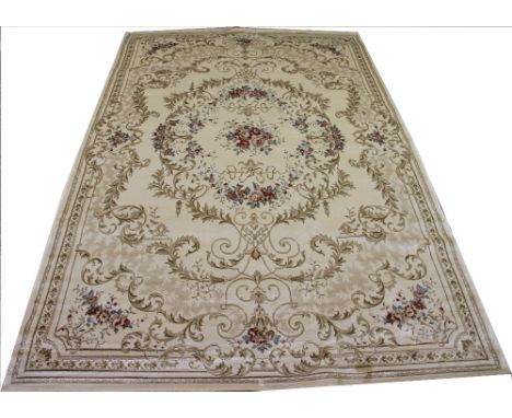 A Kashmir carpet, worked with a floral garland design against an ivory ground, 300cm x 196cm