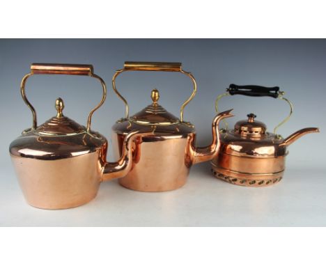 A copper and brass coach lamp, with horse shoe shaped frame, with three copper kettles and a brass preserve pan (5)