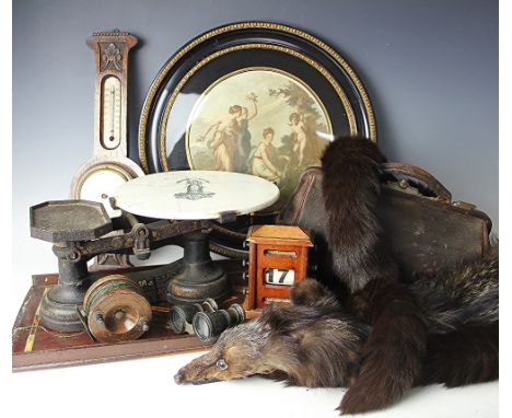 A set of 19th century cast iron scales, a leather doctors bag, a treen sea fishing reel, three cast iron shoe lasts, a select