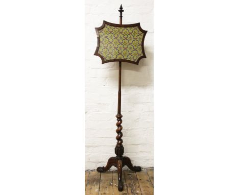 A William IV carved rosewood pole screen, on tripod base with scroll feet, 155cm H