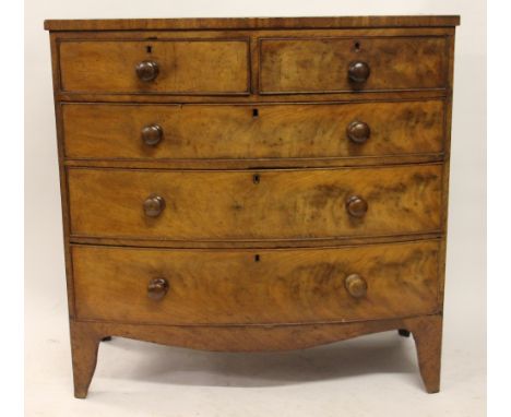 A George III mahogany bow front chest, of two short and three long drawers, on splayed bracket feet, 103cm H x 104cm W x 46cm