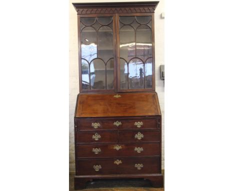 A George III mahogany bureau, with fall enclosing a fitted interior above two short and three long drawers, on bracket feet, 