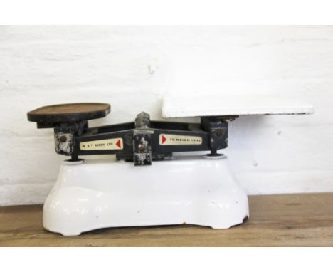 A set of Avery ceramic and cast iron vintage scales, and a pair of brass lamps, 36cm (3) It is recommended that perspective b