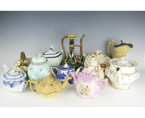 A selection of 19th century and later teapots, to include a Foley Intarsio ewer (lacking cover), a red ware teapot and cover,