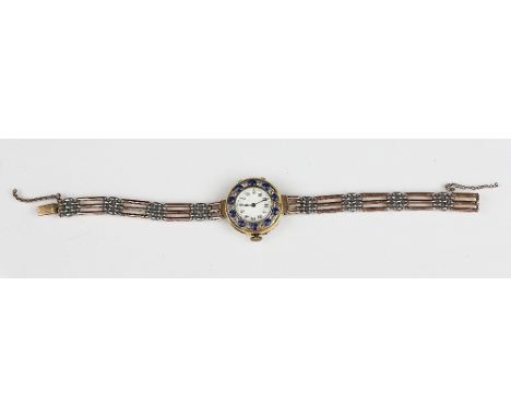 A ladies diamond and sapphire set wristwatch, the bezel set with alternate sapphires and diamonds enclosing a white enamel di