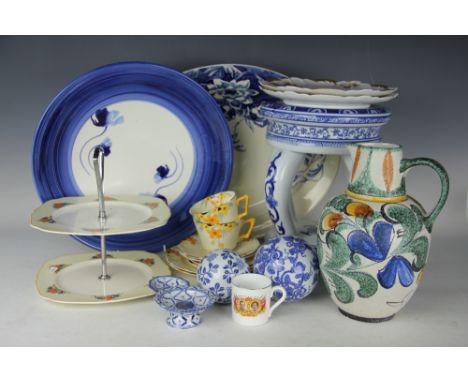 A collection of decorative ceramics to include an Art Deco Sunburst pattern part tea service, blue printed carpet balls, a ga