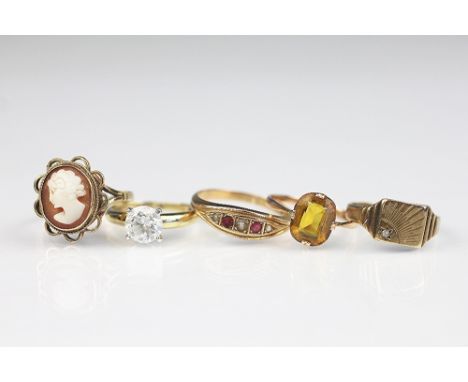 Five assorted rings, to include; a cameo ring, a citrine set ring, a five stone pearl and ruby ring, a cz set dress ring etc,