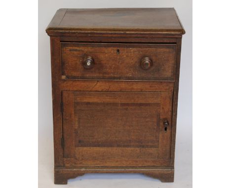 A George III oak and mahogany crossbanded cupboard, with drawer above a cupboard door, on bracket feet, (as found) 76cm H x 6