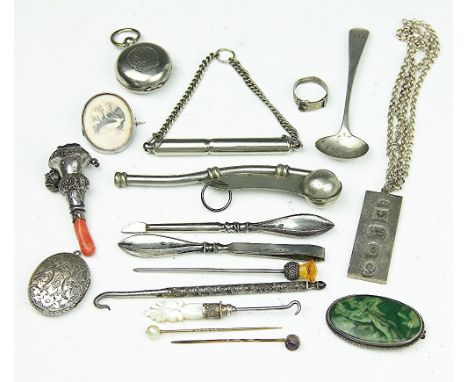 A Victorian silver and coral teether (at fault), a silver ingot pendant and chain, a locket, a silver fob, a sovereign case, 