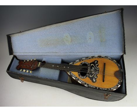 A mother of pearl inlaid mandolin, 61cm, with a flat back mandolin with inlaid floral detailing (2) (as found)