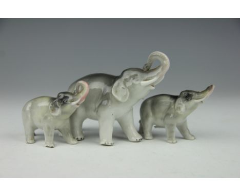 Three Sitzendorf elephant ornaments, each modelled standing and with trunk raised, glazed in naturalistic tones, 10cm high -7