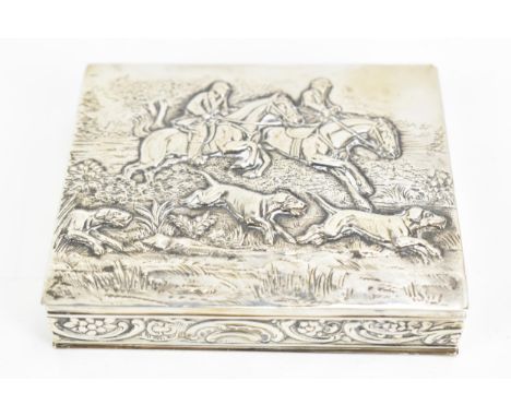 A late 19th/early 20th century German 800 silver box, embossed with a hunting scene to the lid depicting figures on horseback