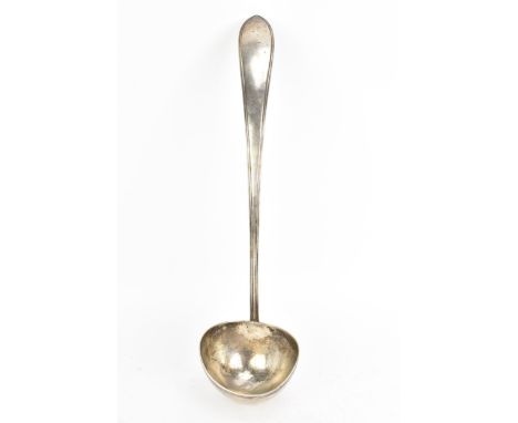 A white metal serving ladle, having a reeded formed handle and stamped marks to the reverse, 36.5cm, 197.6 gramsIf there is n