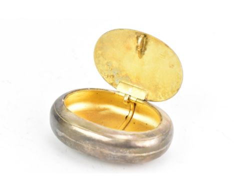 A George V silver snuff box, hallmarked Chester 1919, of oval form, gilded interior, the lid with a circular cartouche engrav