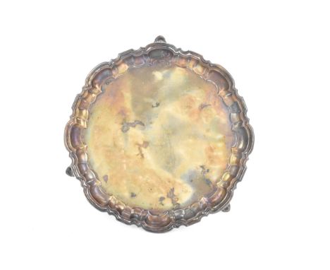 A George V silver card tray, by Mappin & Webb, hallmarked Sheffield 1921, having a Chippendale style rim, engraved to the cen