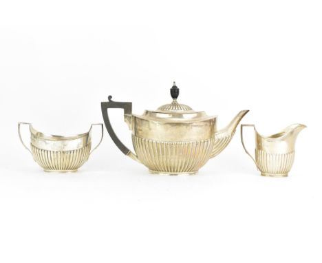 A George V silver three piece tea service, by William Hutton & Sons Ltd, hallmarked Sheffield 1915, consisting of a teapot wi