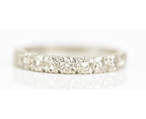 An 18ct white gold half eternity ring, with ten illusion set diamonds, ring size N, 3.4 gramsIf there is no condition report 