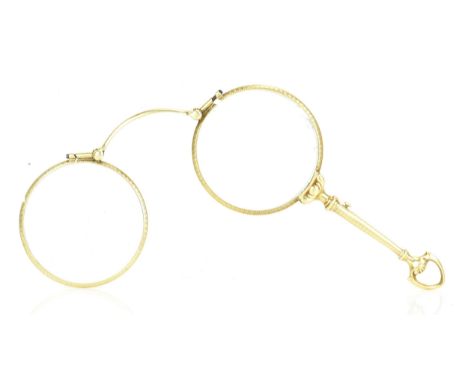 A pair of 14ct yellow gold lorgnettes, having engine turned decoration and spring mechanism, the bridge stamped D14k, 23.5 gr