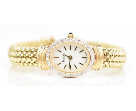 A Bulova, quartz, ladies, 14ct yellow gold wristwatch, the white dial having gilt baton markers, surrounded by a diamond encr