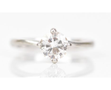 A platinum and diamond engagement ring, the brilliant cut diamond approx weight 1-1.1ct, approx clarity VS, ring size K 1/2, 