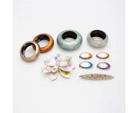 Comprising four bangle bracelets and six brooch pins, approximately [10] pieces.Largest diameter 6 inches (5.2 cm).Overall go